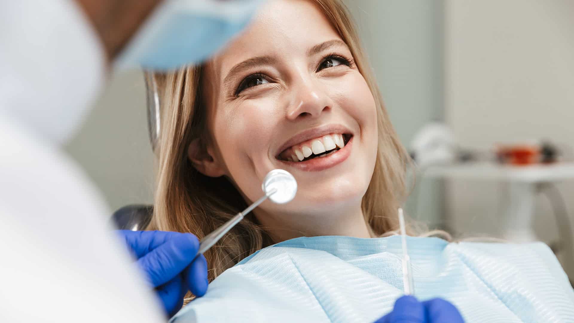 Woman Smiling After Dental Crown Procedure