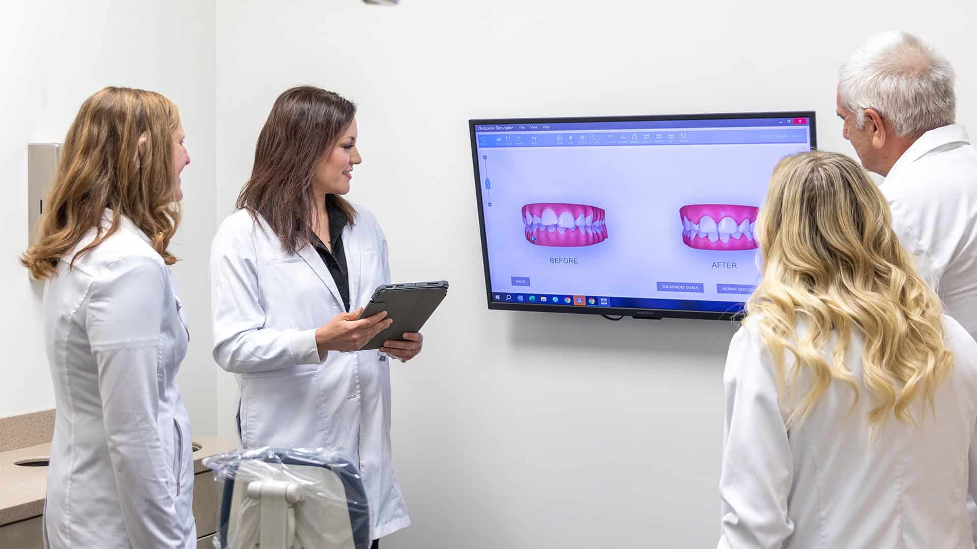 Dentists Discussing Before and After Denture Results