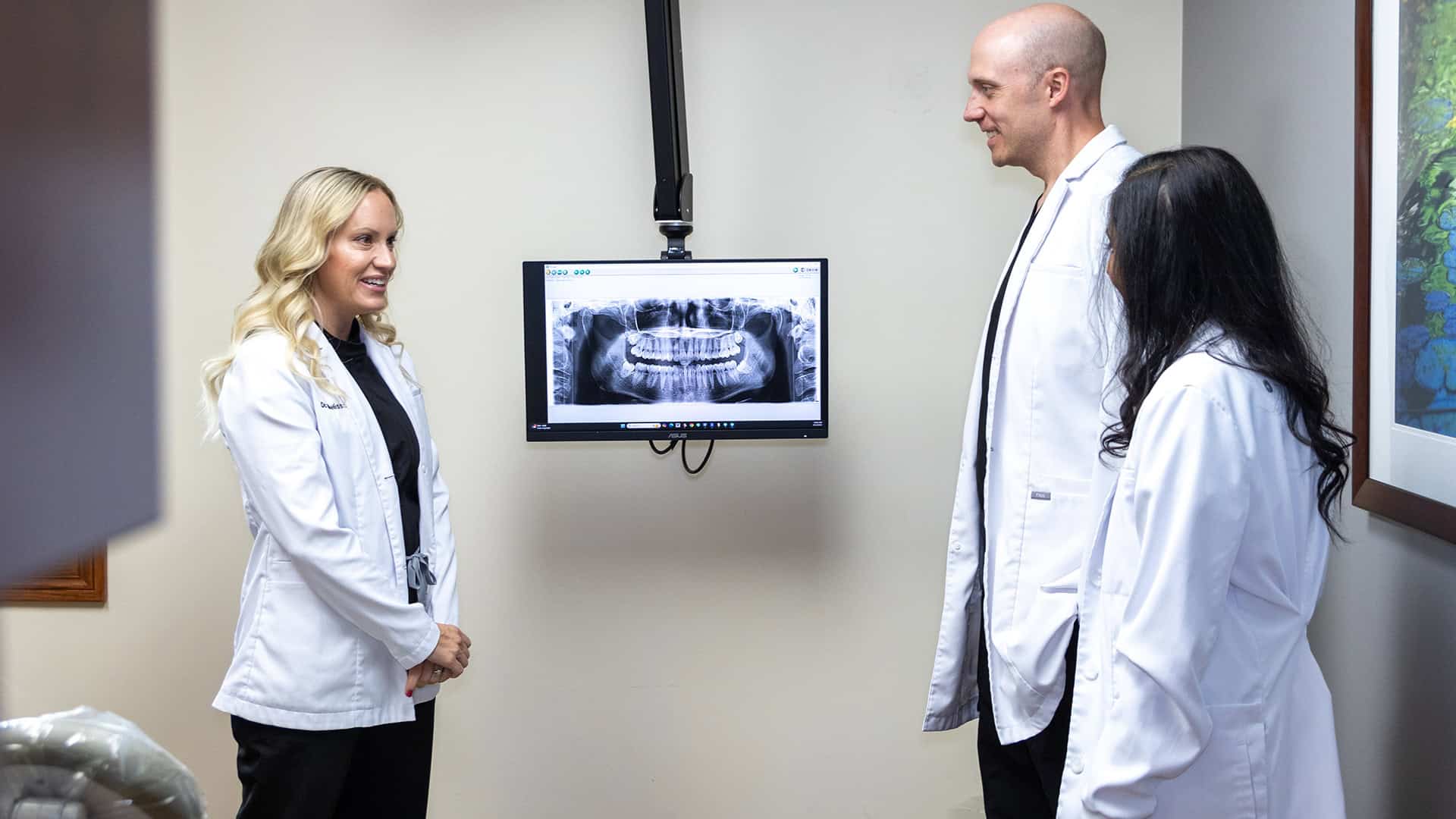 Dentists Reviewing X-Ray of Tooth-Colored Fillings