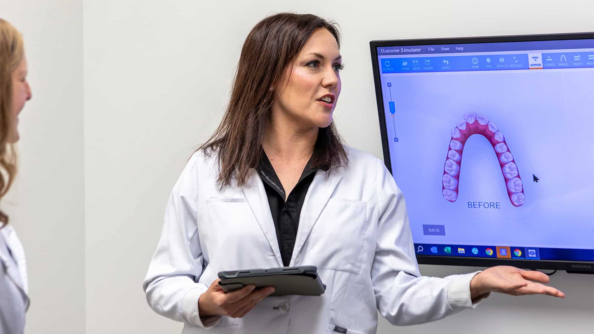 Dentist Reviewing Teeth Before Veneers